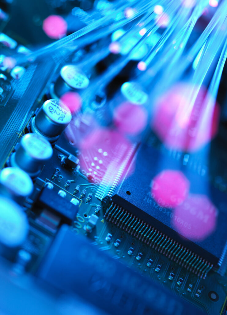 Close-up of computer circuitry with blue and pink lights